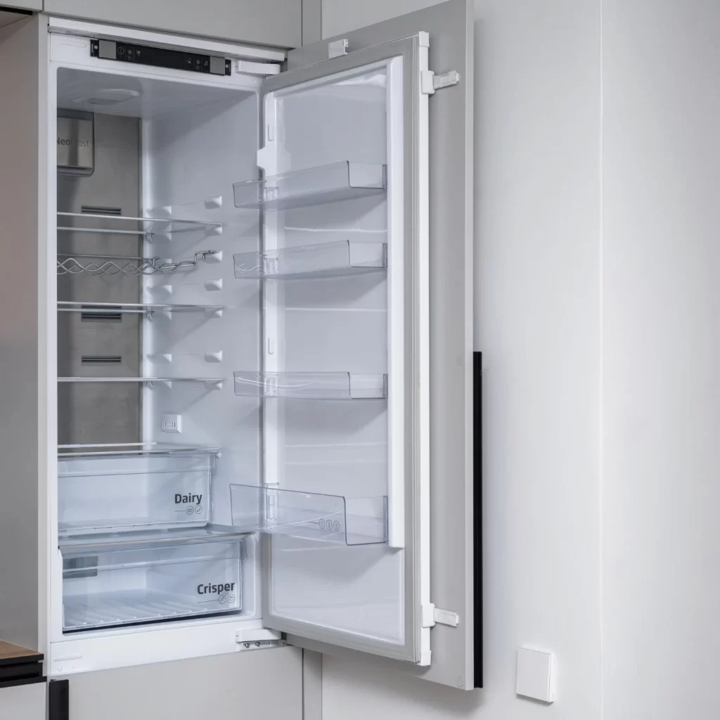 empty builtin refrigerator after cleaning