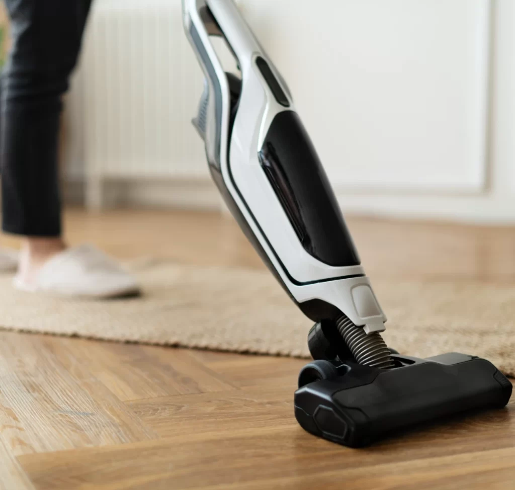 white and black vacuum cleaning