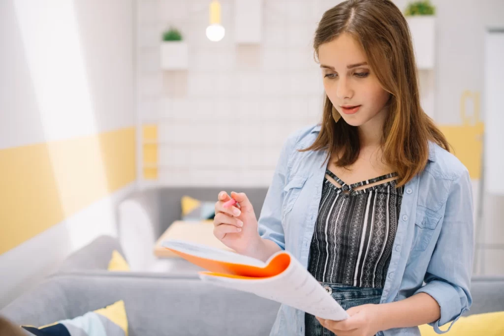 Concentrated girl posing with daily cleaning checklist